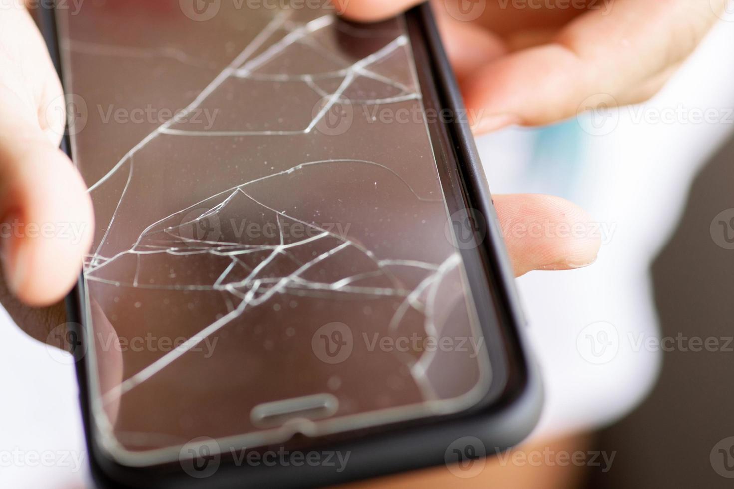 Broken protective film on a smartphone display photo