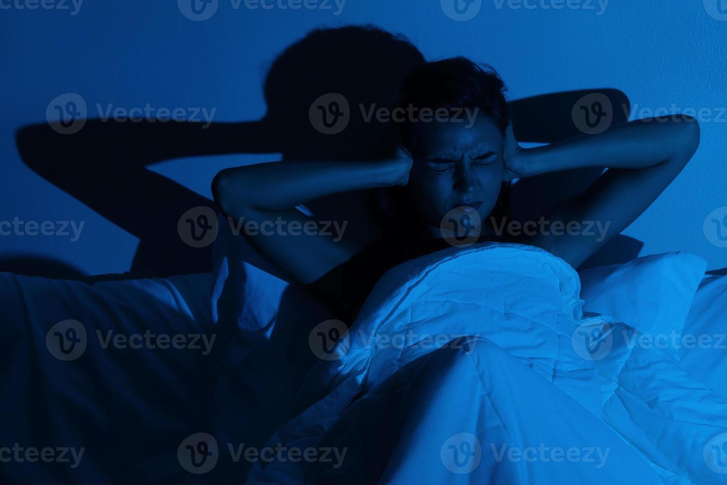 Woman with insomnia because of loud noises photo