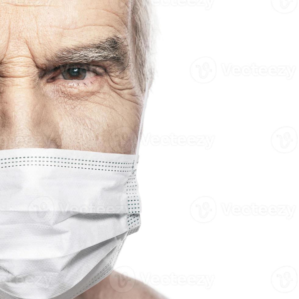 Elderly man wearing facial mask during virus epidemic photo