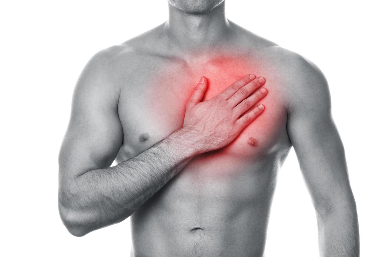 Young man with pain in his chest photo