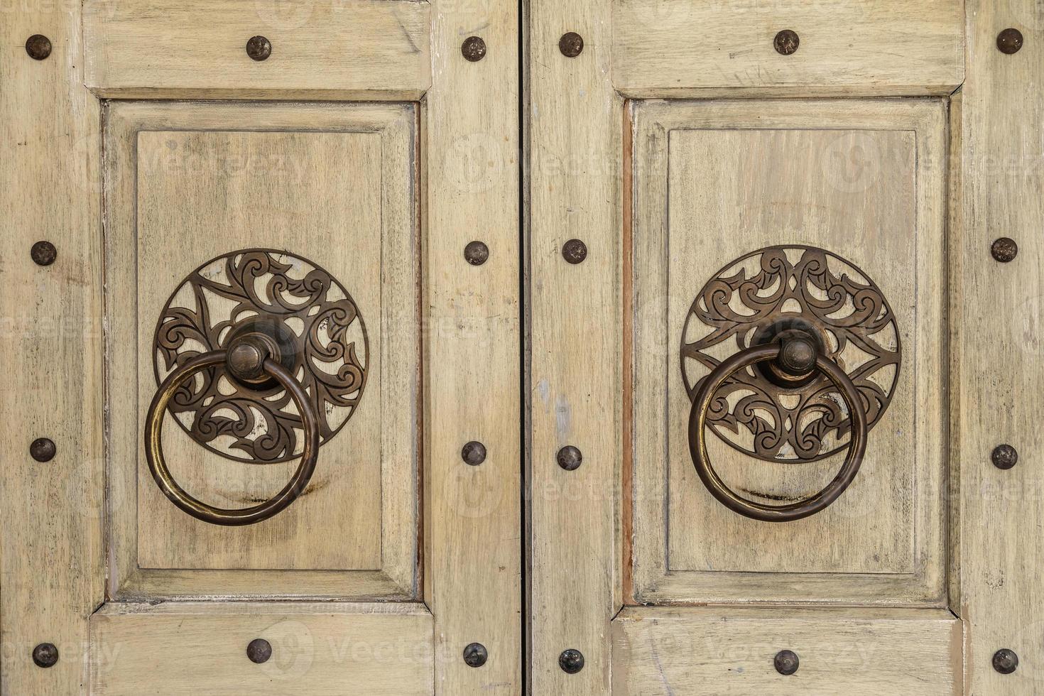 Background of the ancient round door handle photo