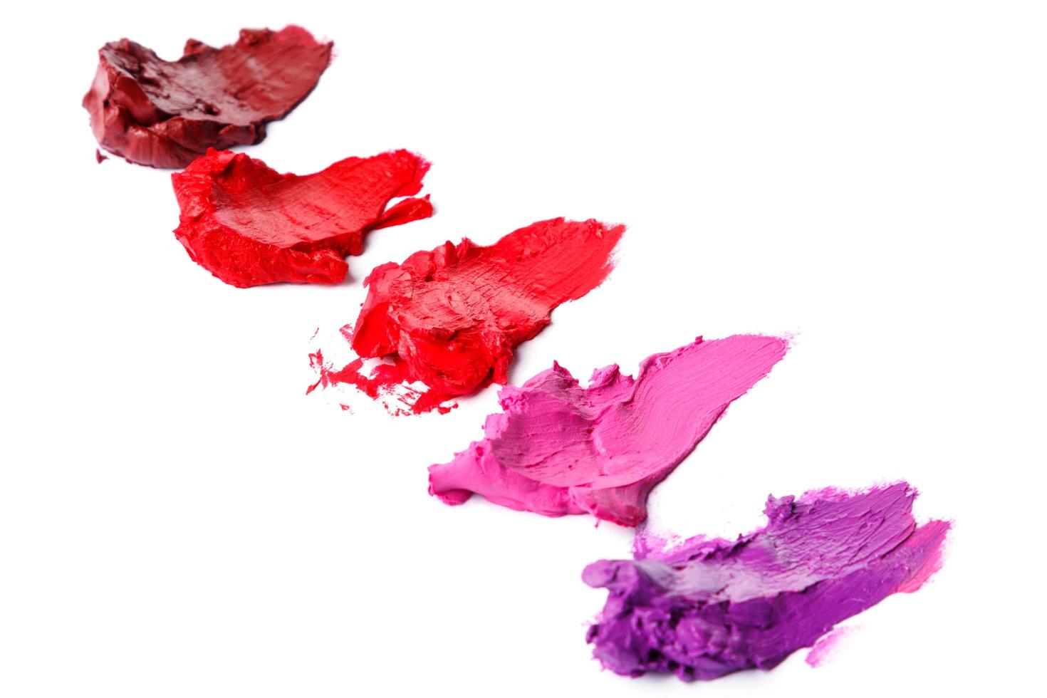 Different multi colored samples of a smudged lipstick photo