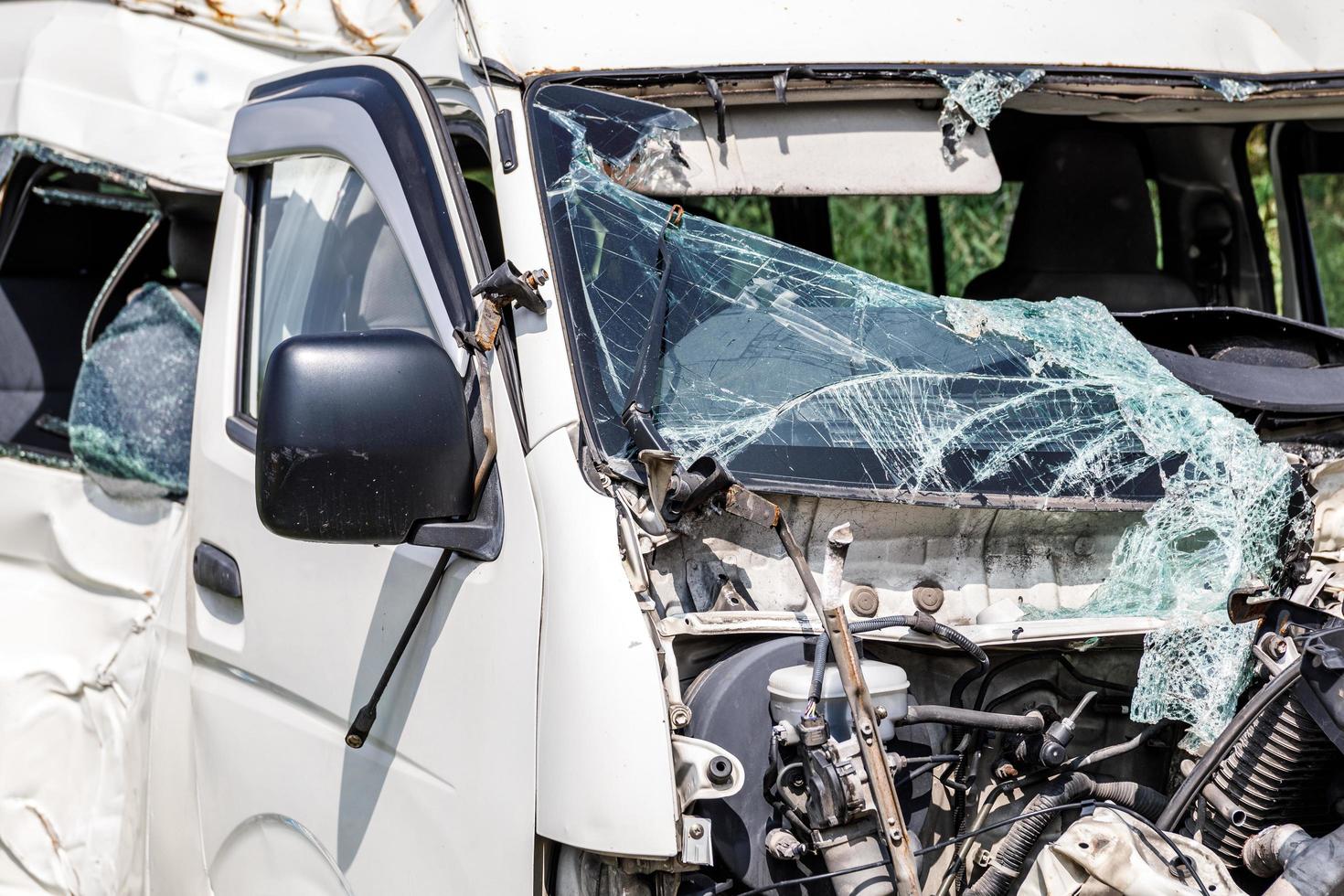 Close up of smashed minivan after serious car accident photo