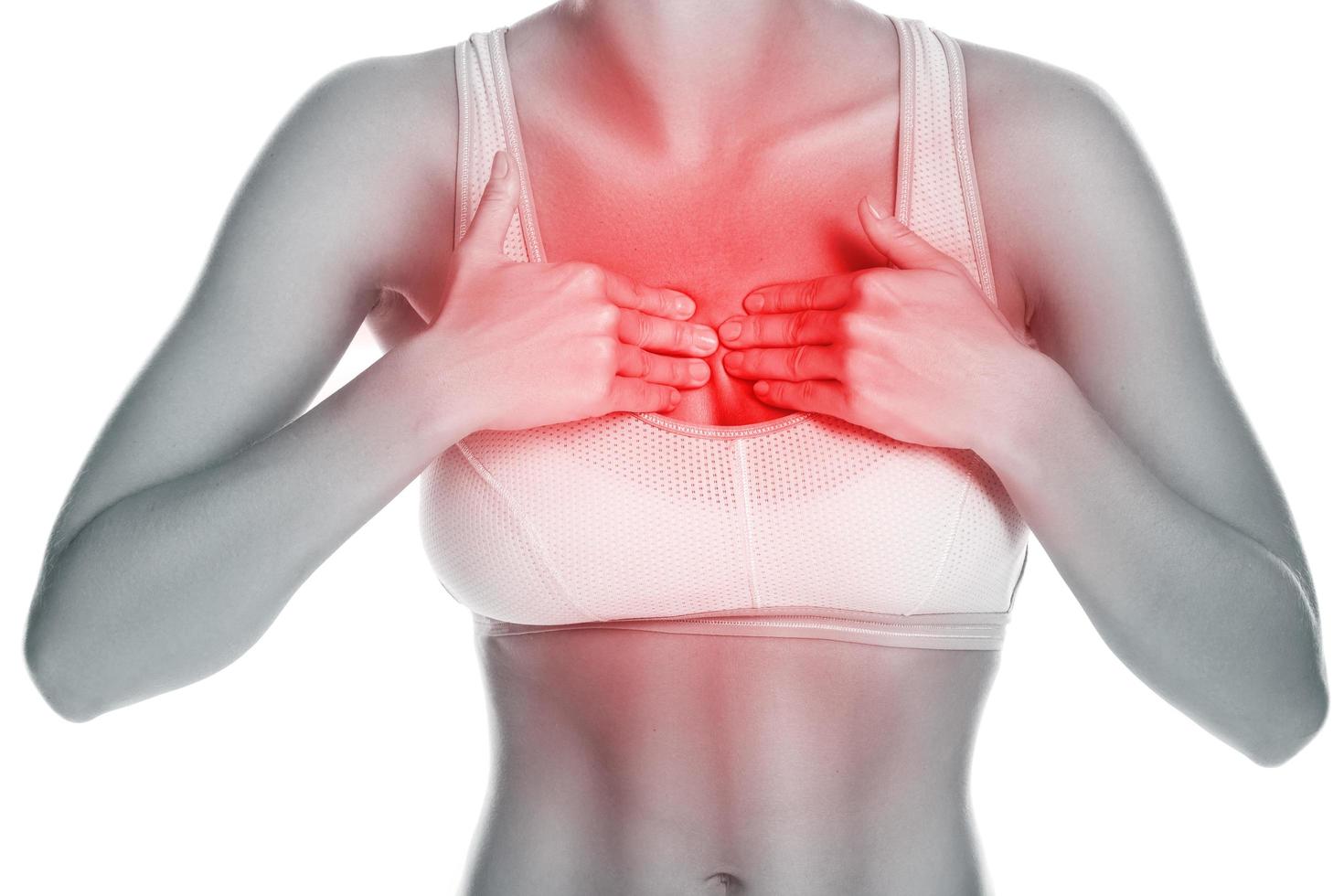 Woman with source of pain in her chest photo