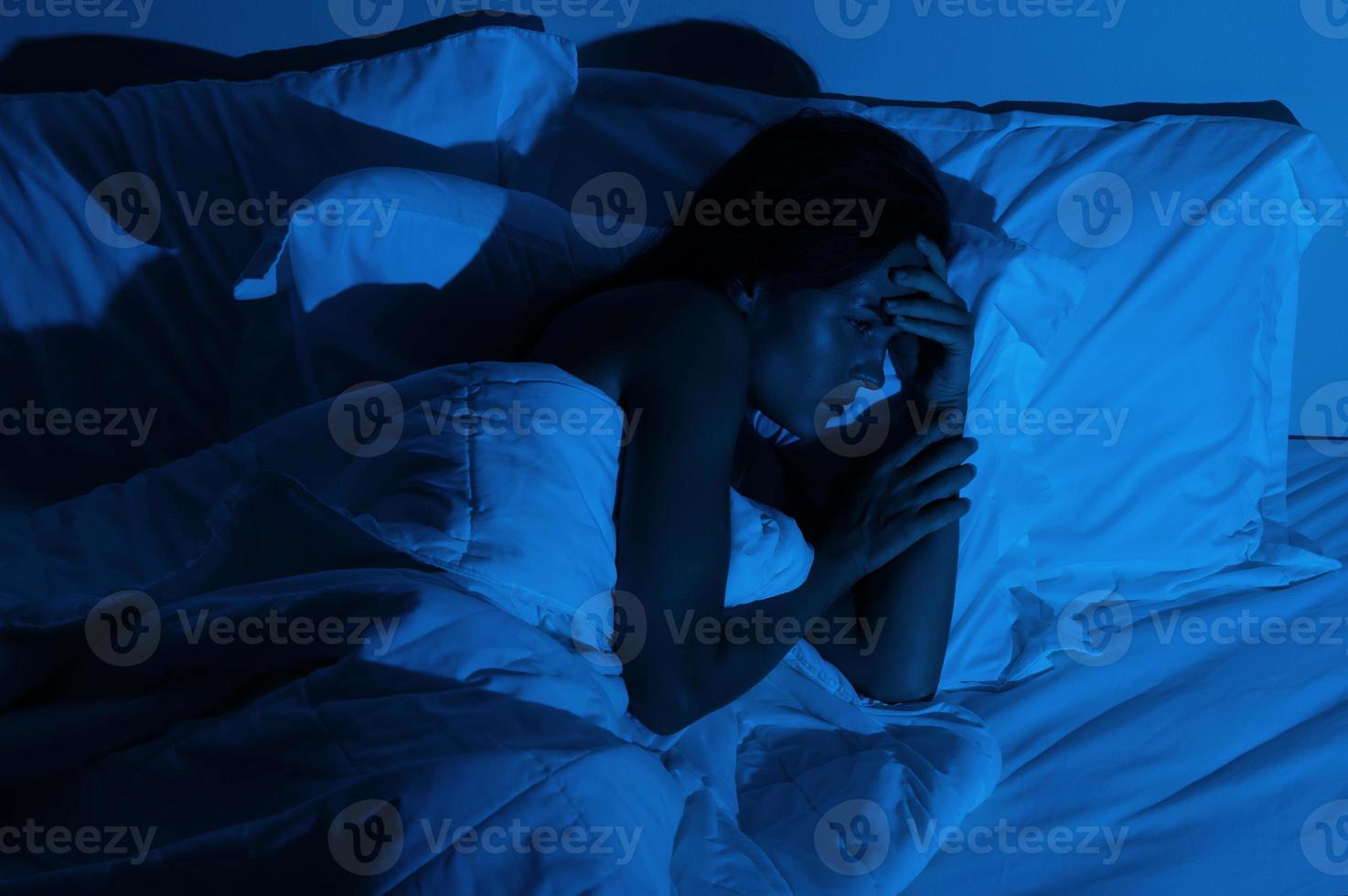 Young woman with a headache and insomnia photo