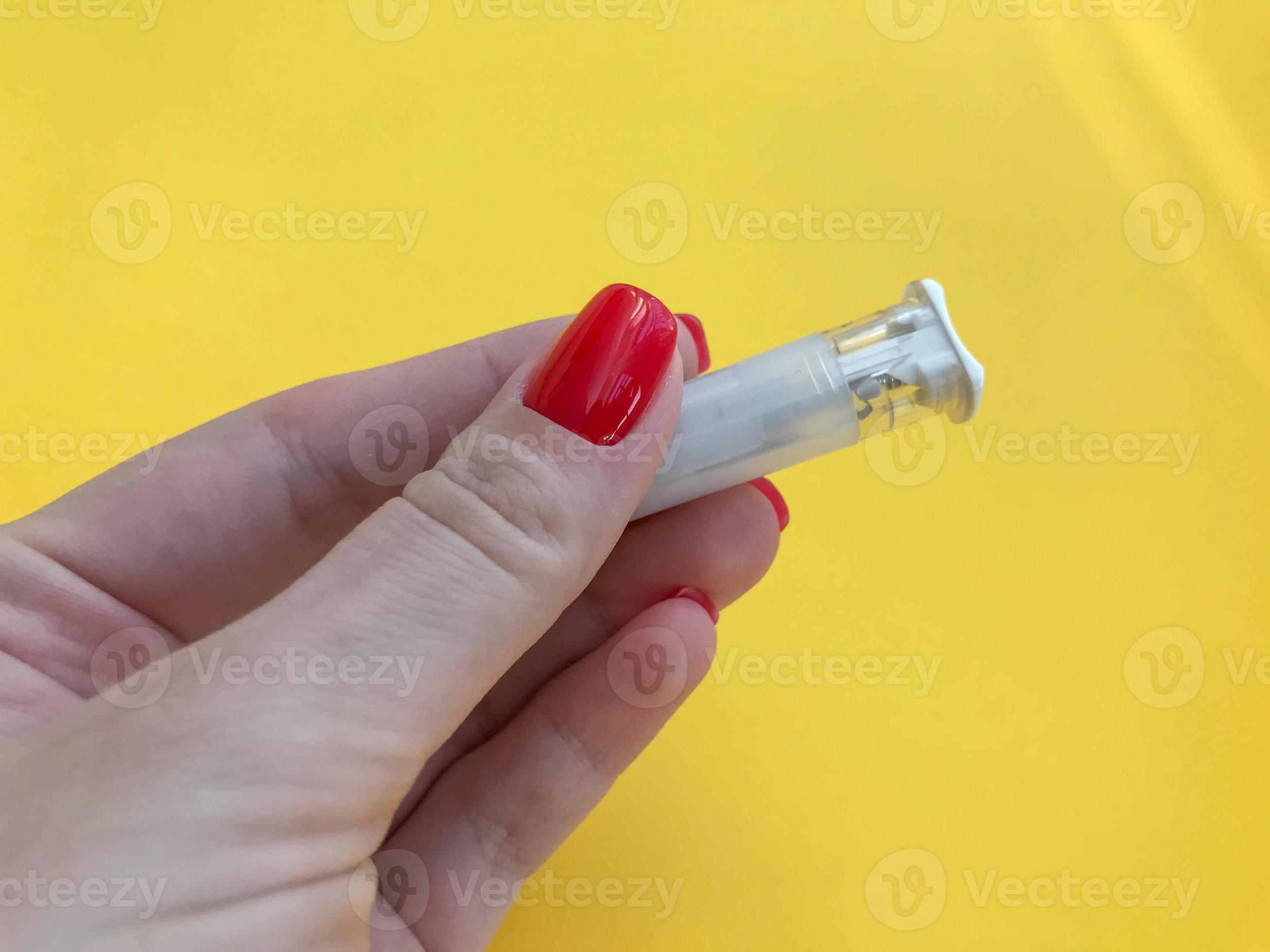 medical procedures. lancet on a bright yellow background. girl with a