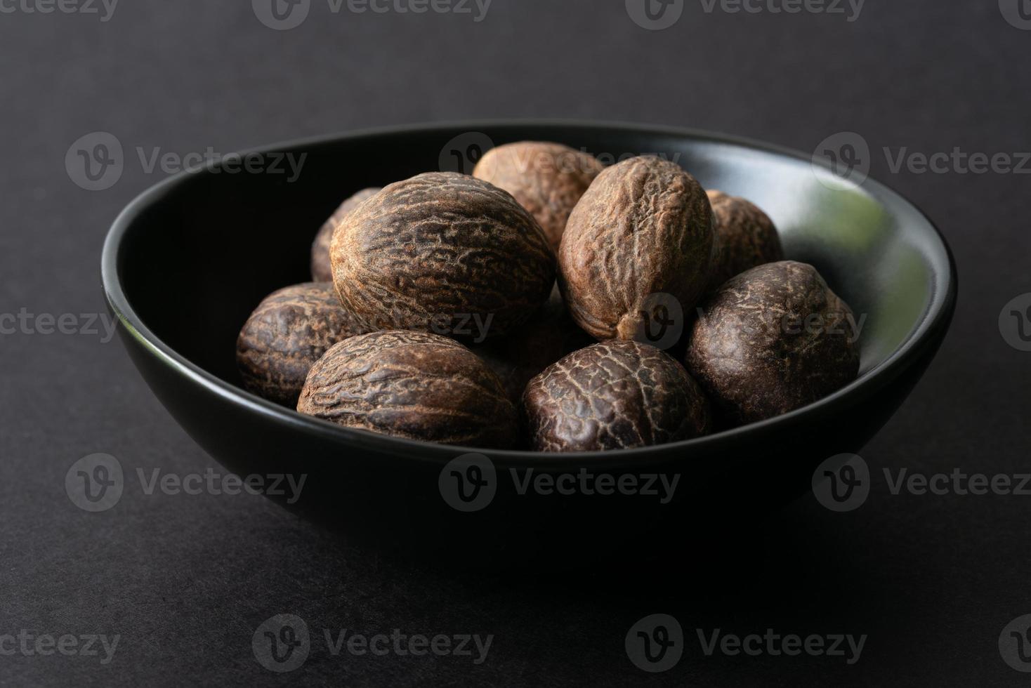Whole Nutmeg in a Bowl 14376543 Stock Photo at Vecteezy