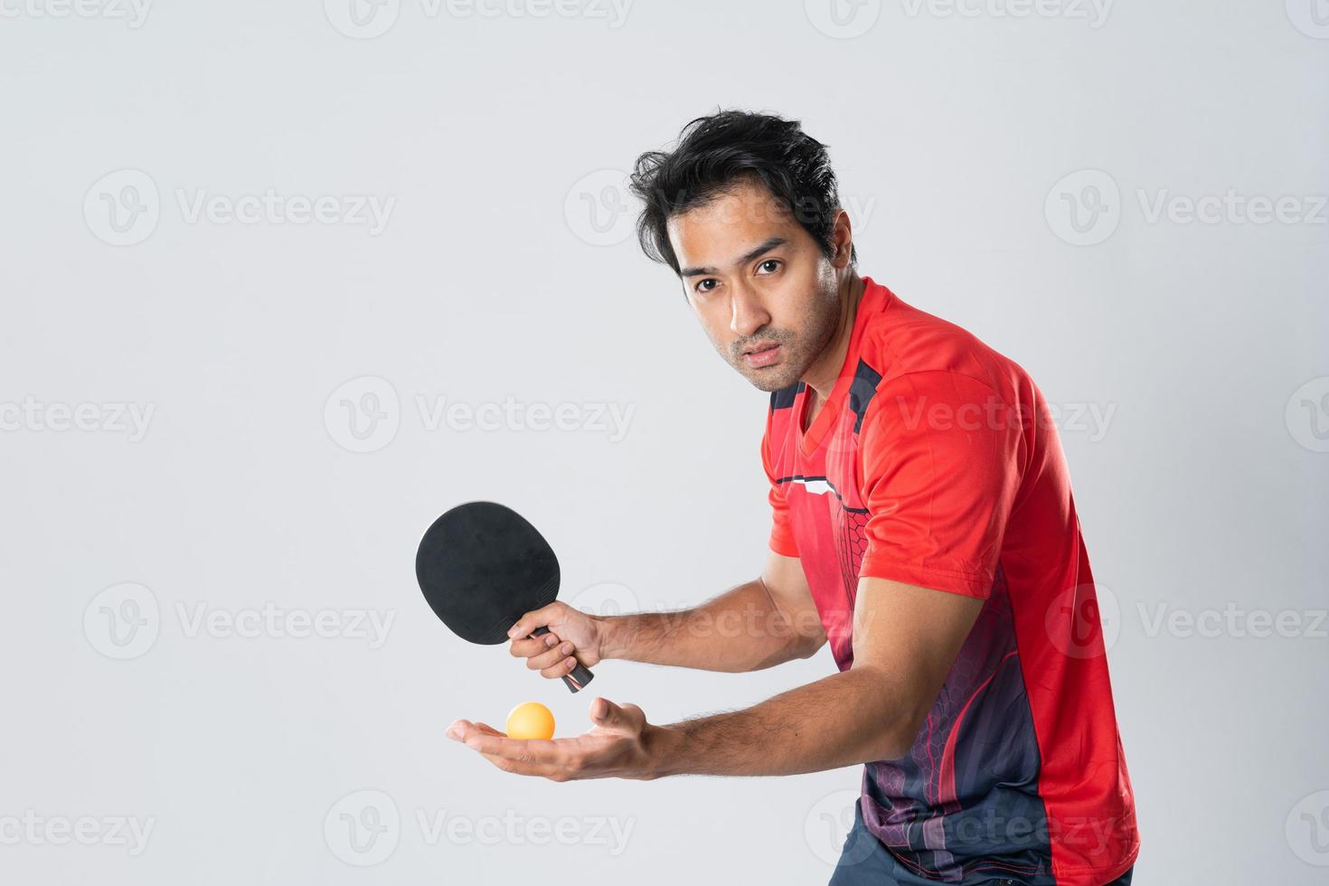 Portrait of sports man male athlete playing table tennis isolated. photo