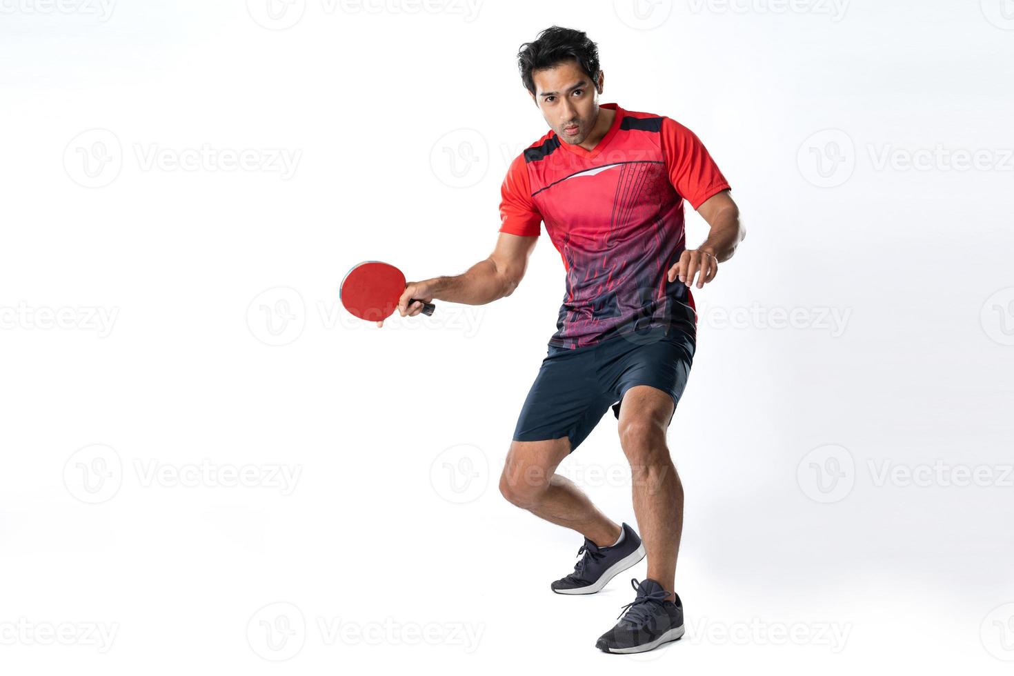 Portrait of sports man male athlete playing table tennis isolated. photo