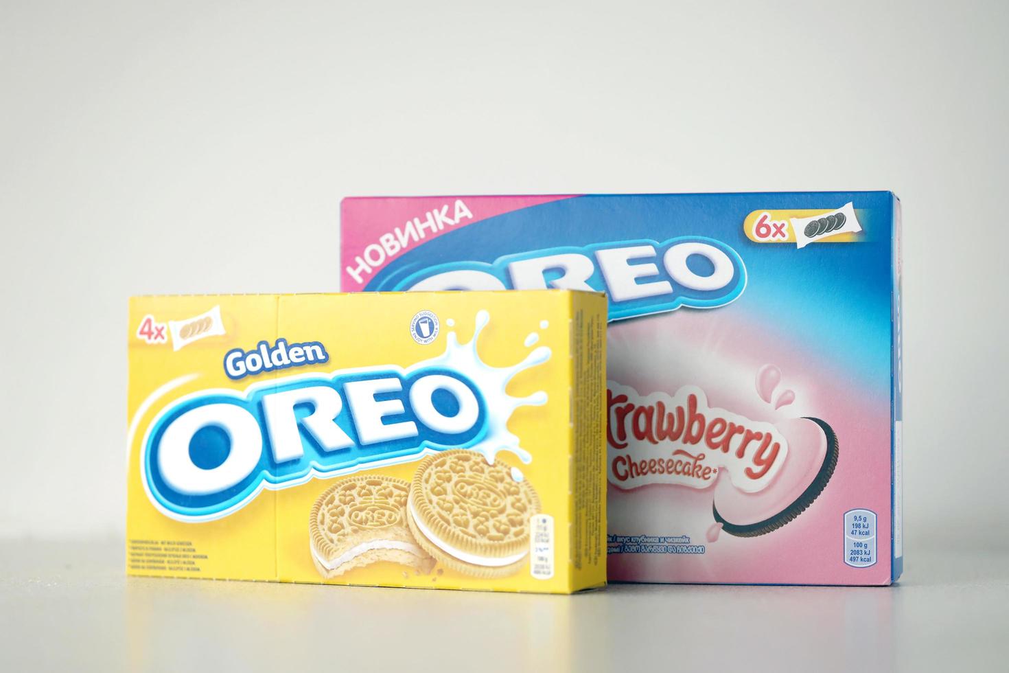 TERNOPIL, UKRAINE - MAY 28, 2022 Oreo golden and strawberry cheesecake crispy cookie box. The brand Oreo is owned by company Mondelez international photo