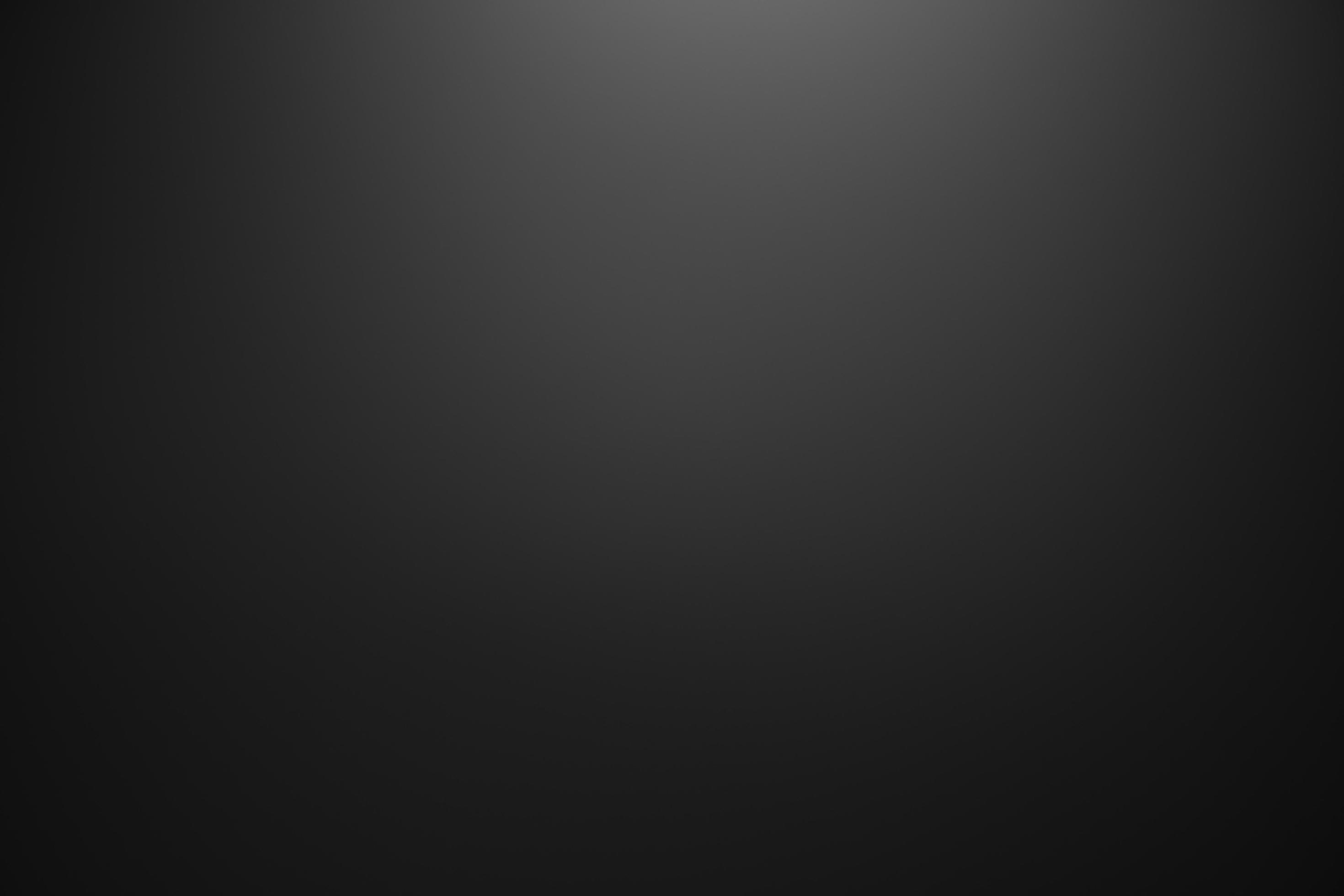Dark black and gray blurred gradient background has a little