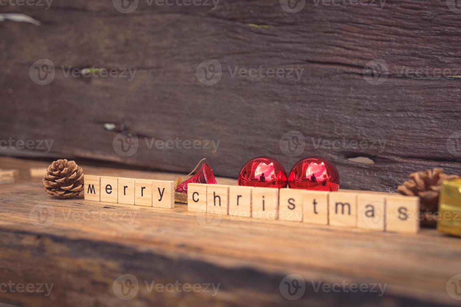 Merry Christmas. Christmas greeting card with rustic wood and ornaments. photo