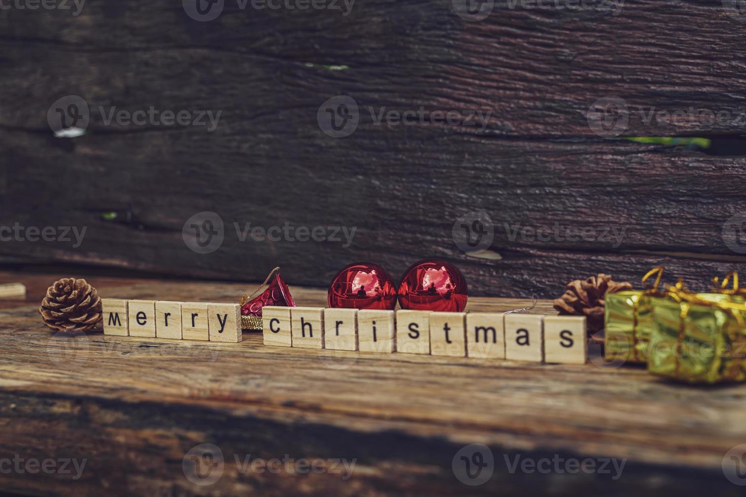Merry Christmas. Christmas greeting card with rustic wood and ornaments. photo