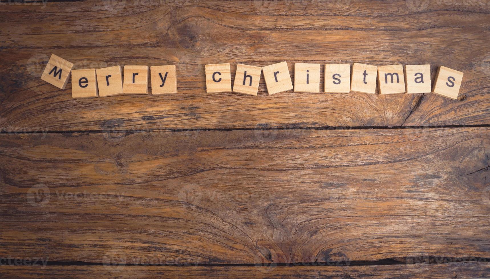 Merry Christmas. Christmas greeting card with rustic wood and ornaments. photo