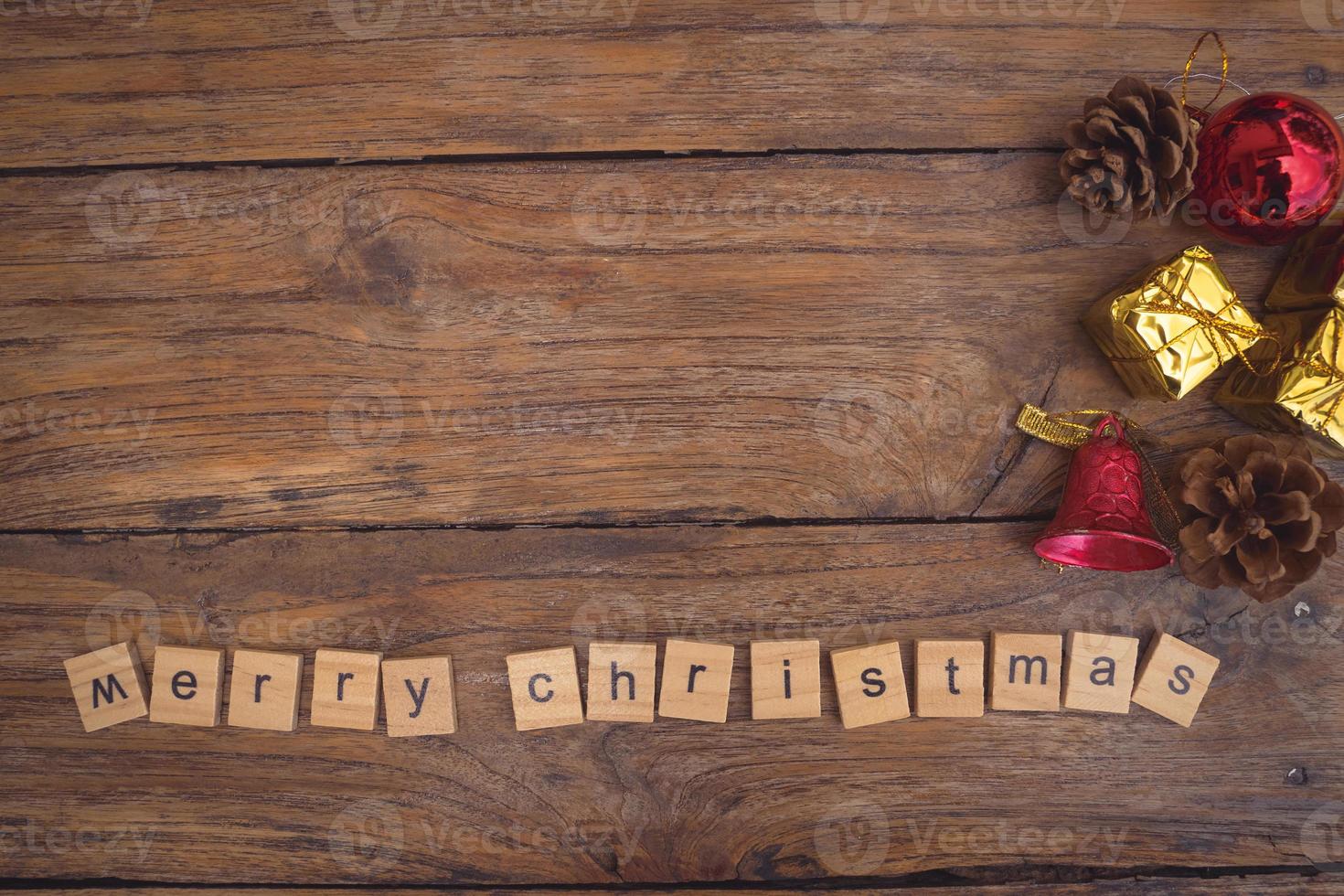 Merry Christmas. Christmas greeting card with rustic wood and ornaments. photo