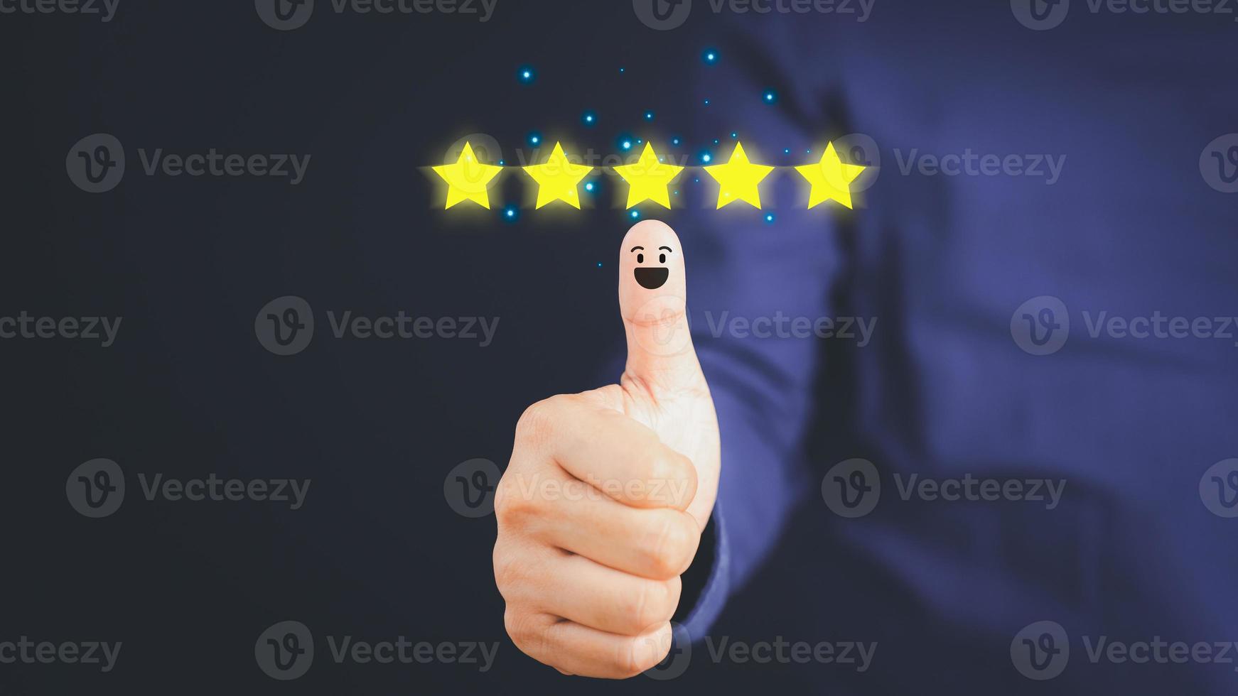 Thumb up for the positive emotion and five star smiley face icon with copy space. Customer Satisfaction and Testimonial Concept. photo