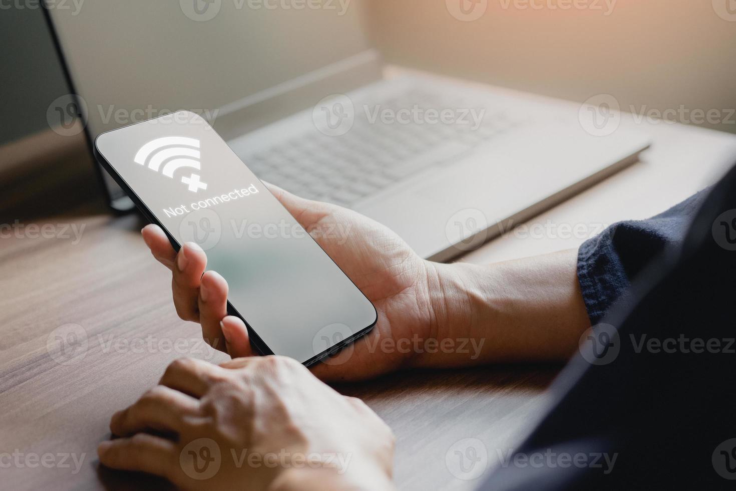 Man using a mobile phone to connect to wifi but wifi not connected, and waiting to loading digital business data form website, concept technology of waiting for connect to wifi by smartphone. photo