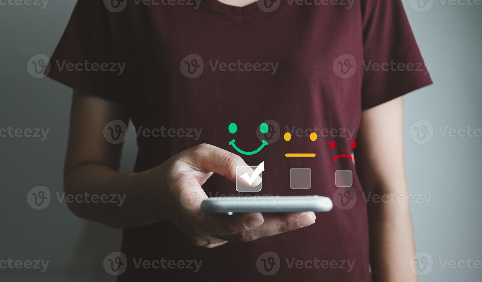 Customer satisfaction very good service with smart phone, impression of take care and attention, choose a smiley face icon, answer the survey, give the highest score, very happy feedback from guest. photo