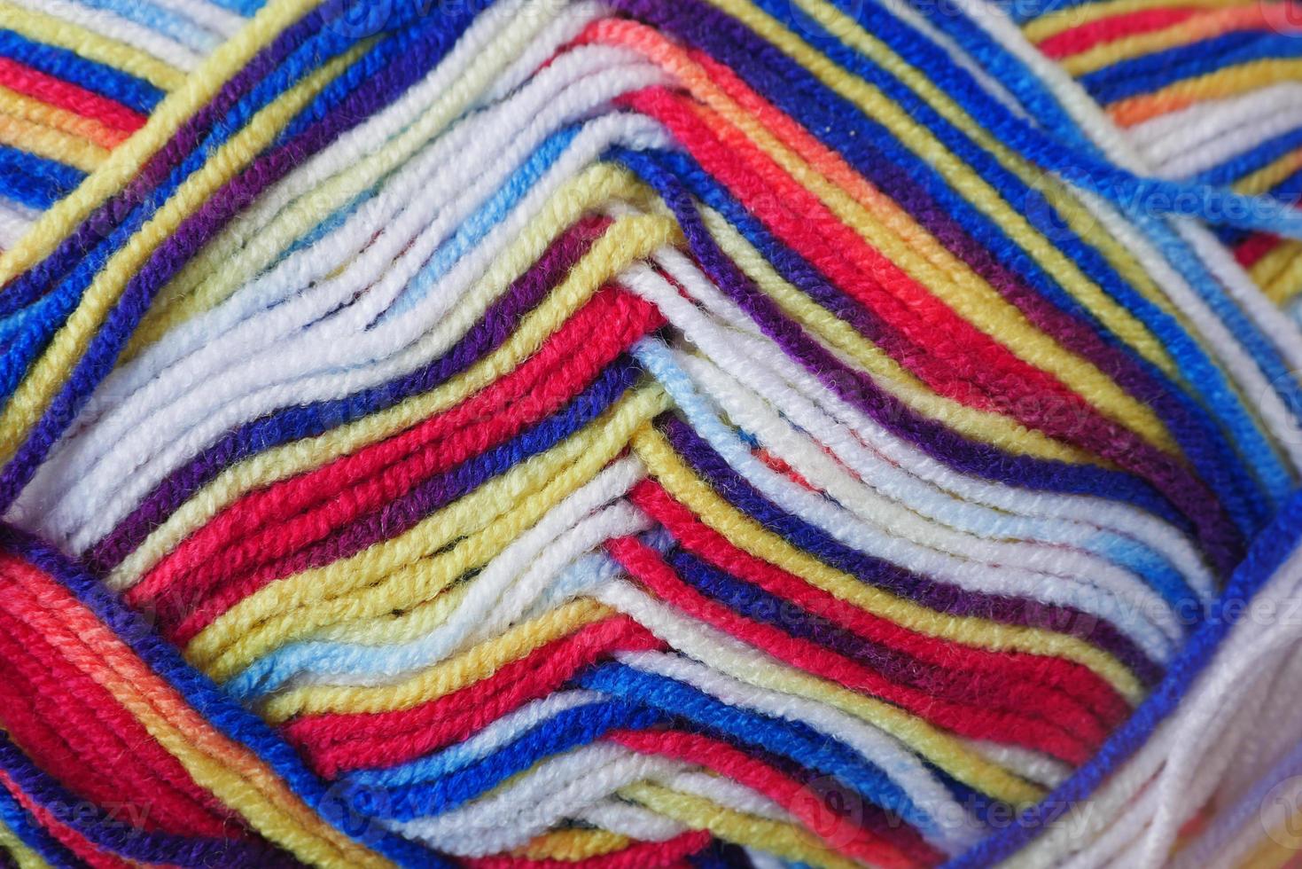 detail shot of colorful yarn on table photo
