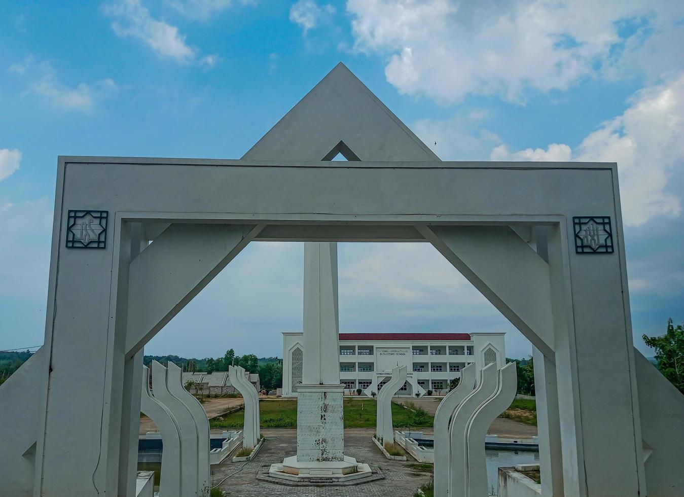 white gate in front of an Islamic school photo