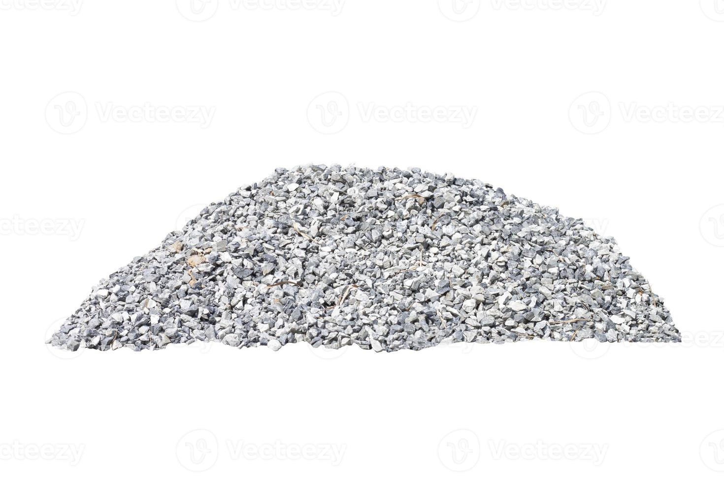 Pile of construction gravel or stone at construction site in the heat of the sun isolated on white background included clipping path. photo