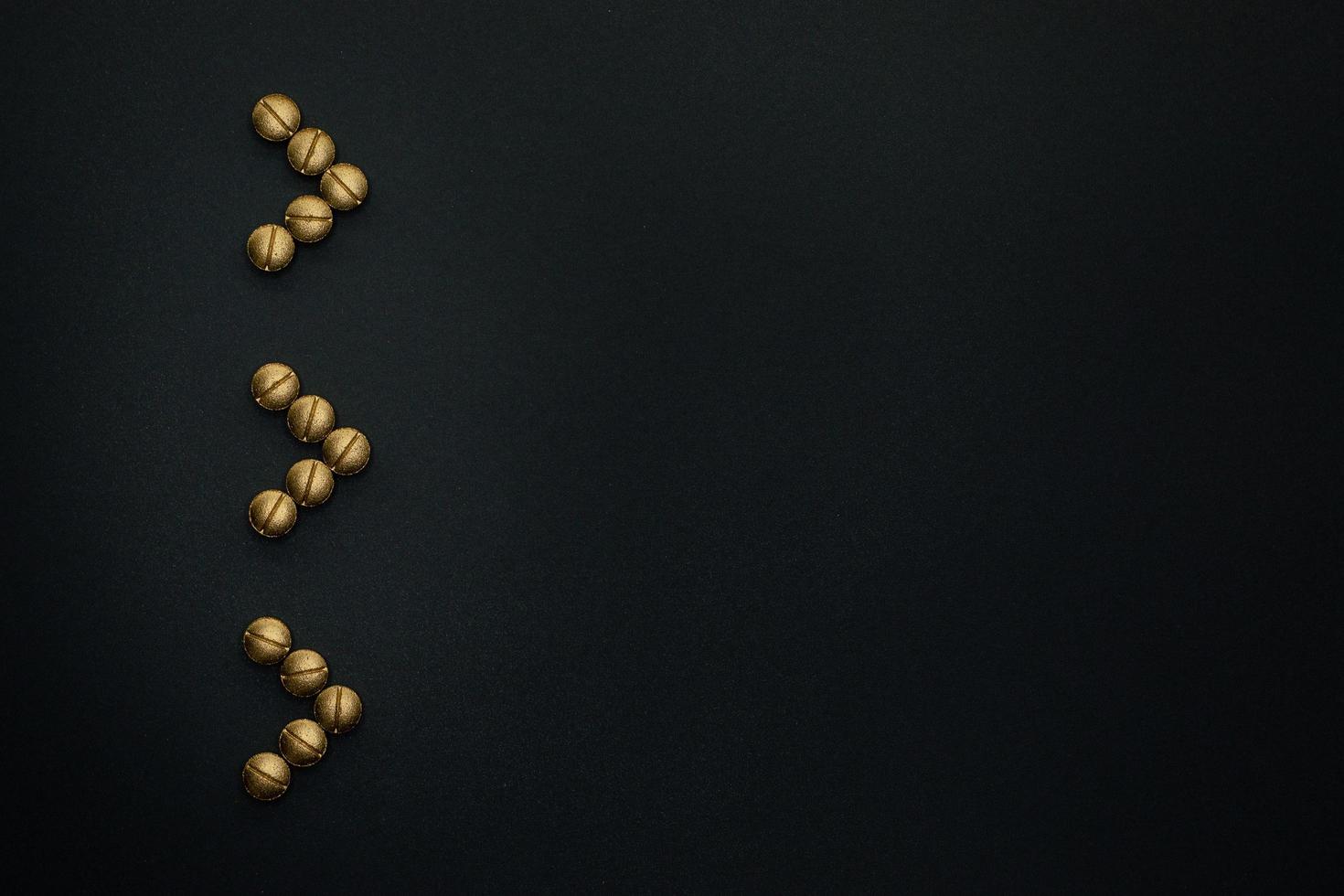 pills arrows on black background photo