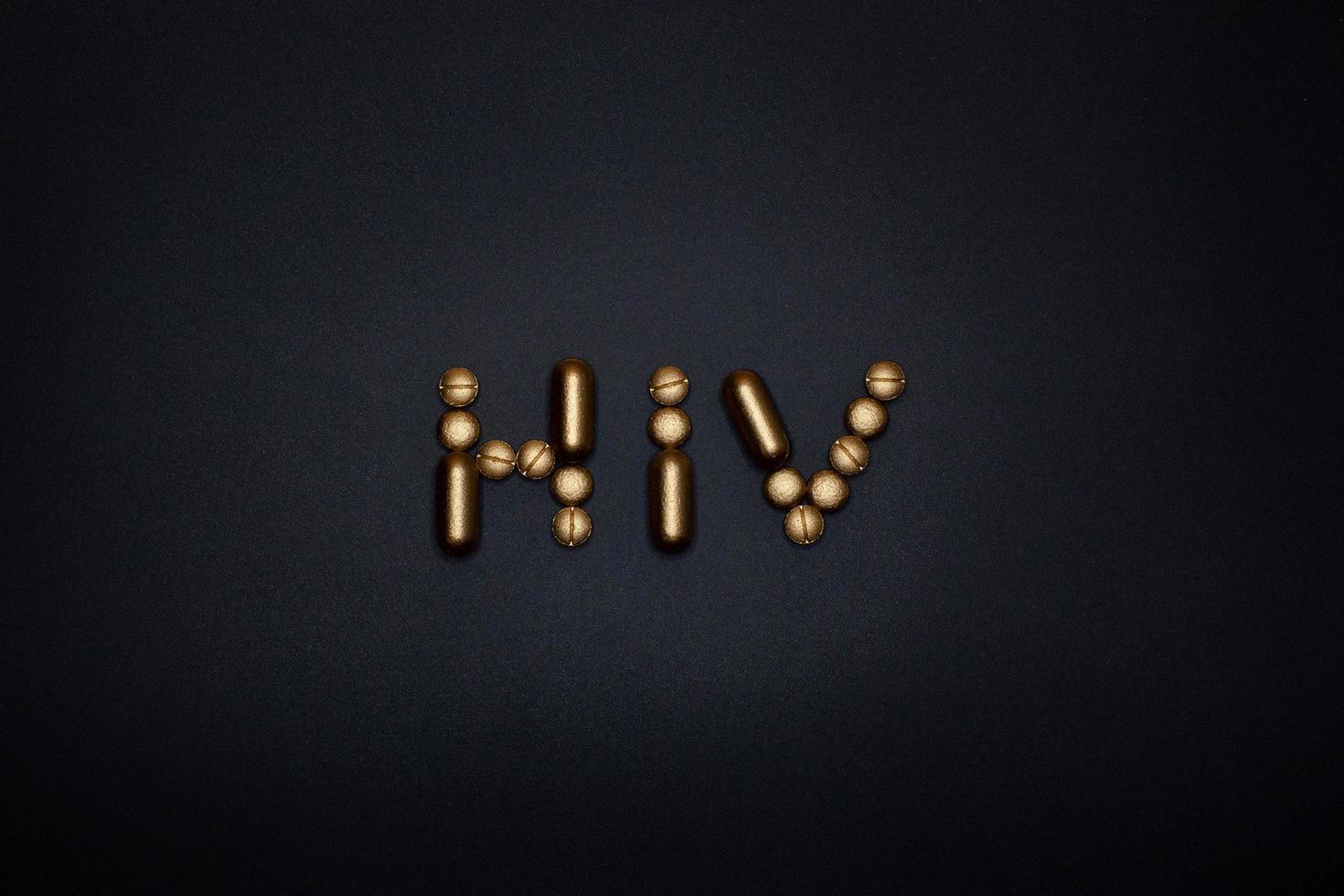 hiv word on black background photo