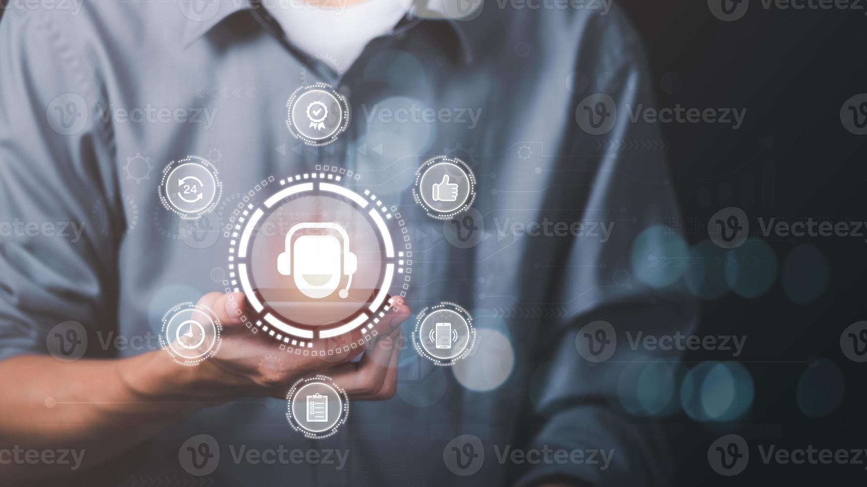 man holding smartphone showing a concept Customer Support Hotline Contact Us Connectivity ,Cyberspace through the online system in everyday life. that plays a role in finance, shopping and marketing photo