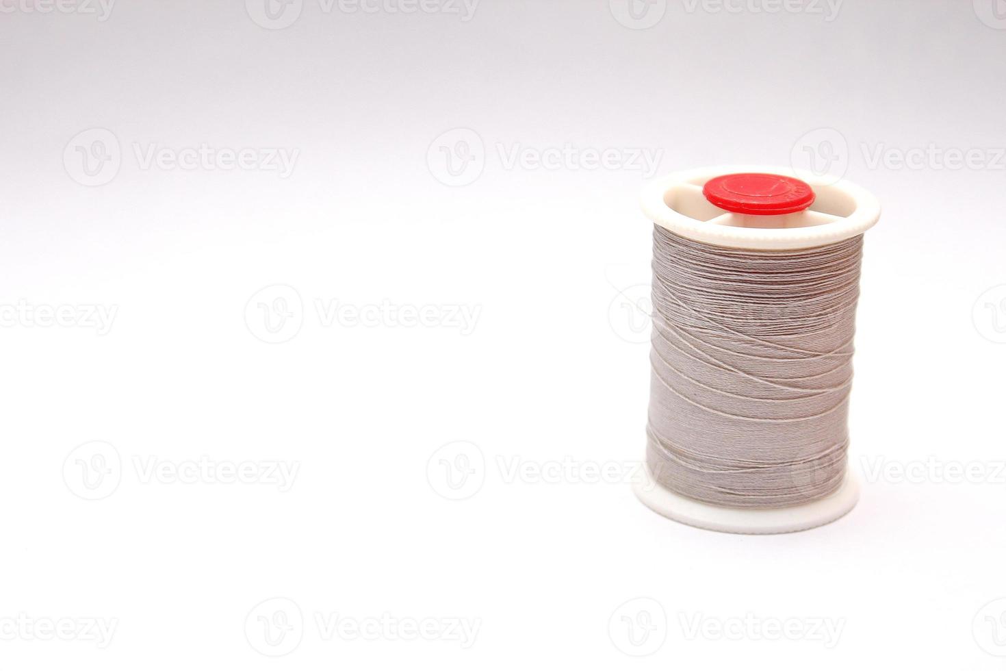 Gray spools placed on a white background. photo