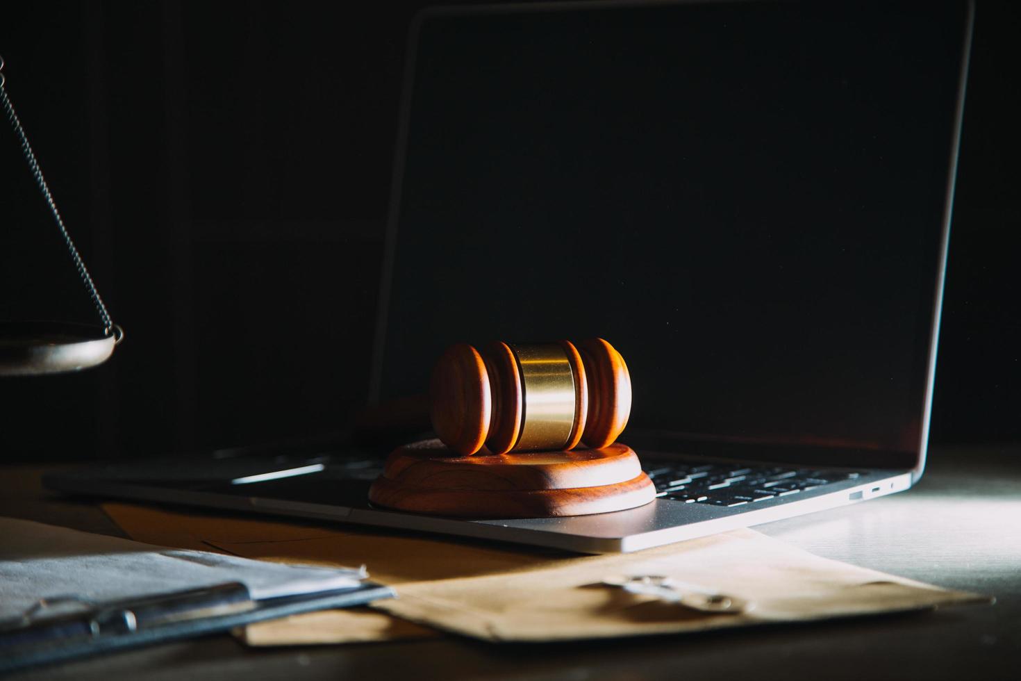 Business and lawyers discussing contract papers with brass scale on desk in office. Law, legal services, advice, justice and law concept picture with film grain effect photo