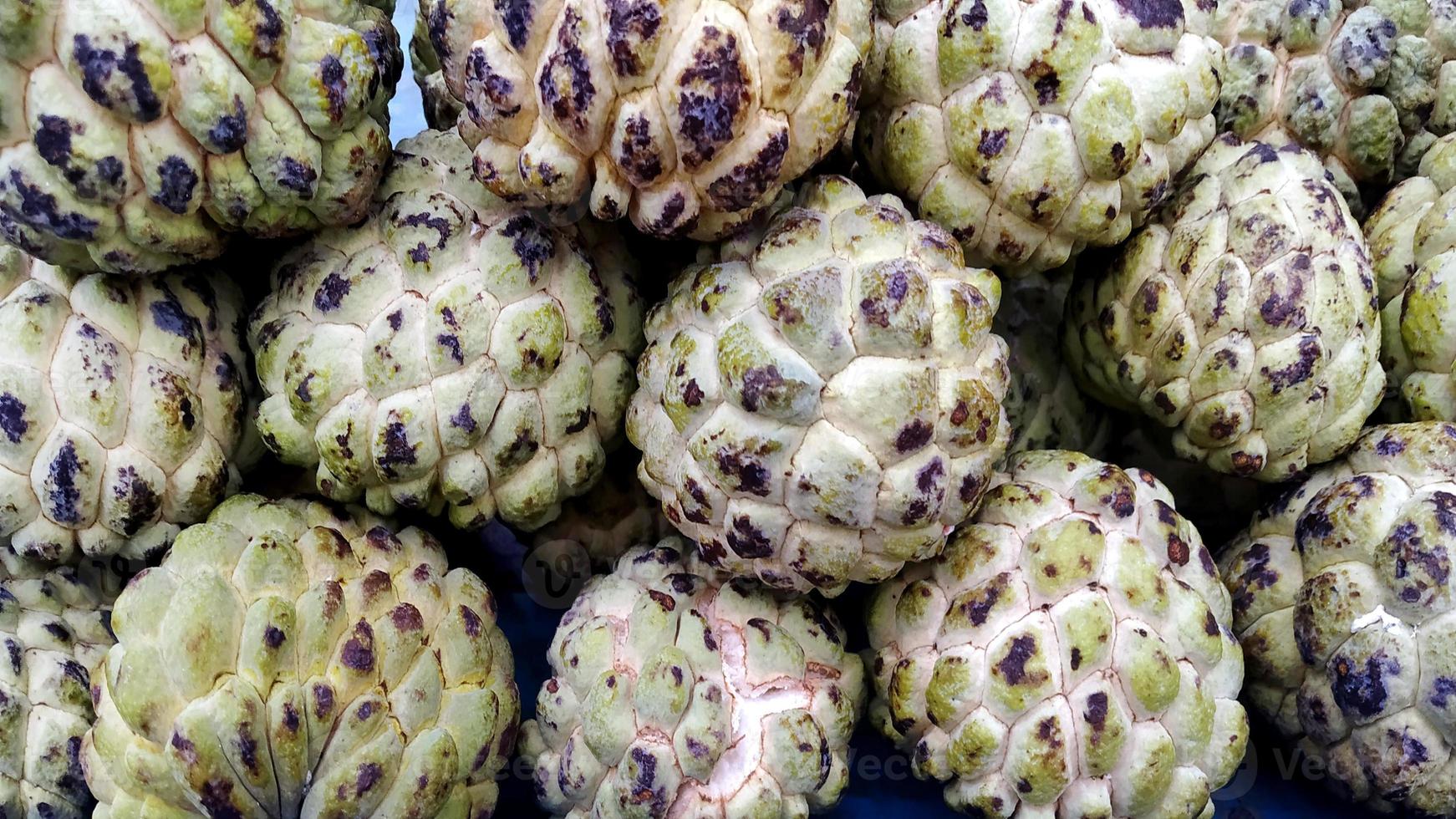 close up custard apple fruit to sell in fresh market. Annona reticulata photo