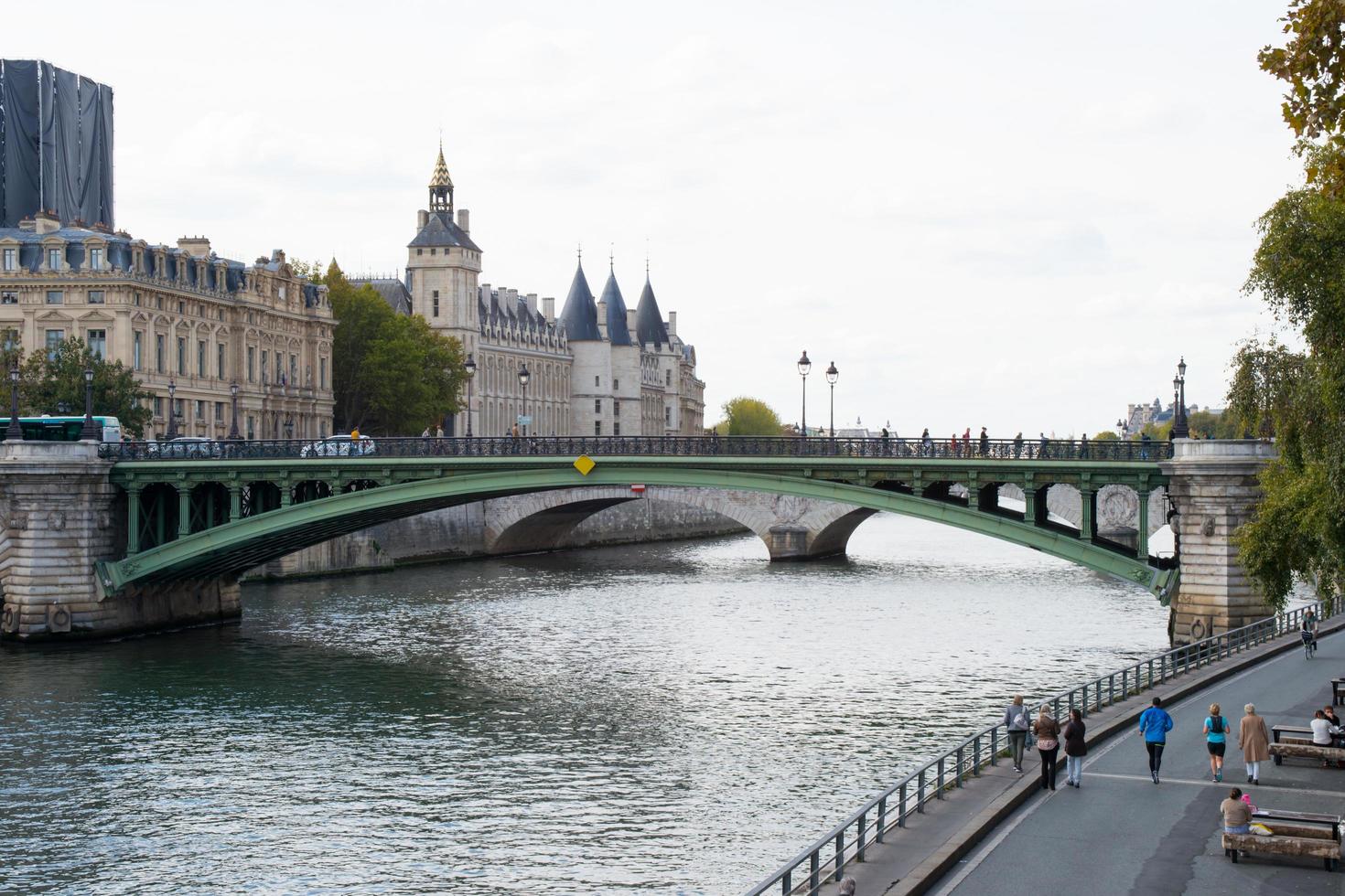 Chatelet Palace next to the Seine river in Paris. Green bridge. photo