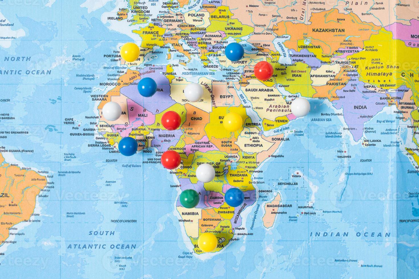 various locations with pins, push pin on map closeup photo
