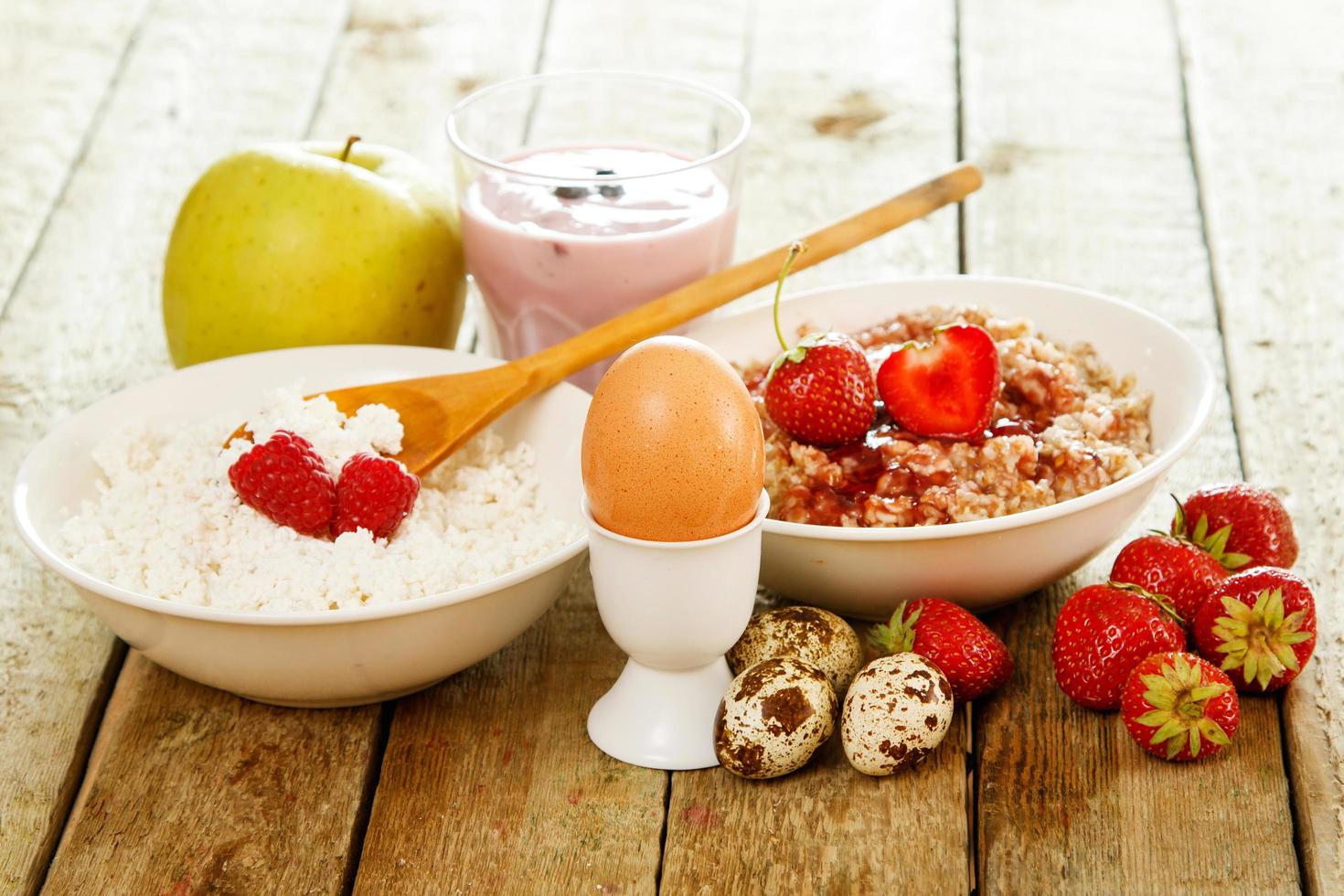 Healthy breakfast. Different food on wooden table. photo