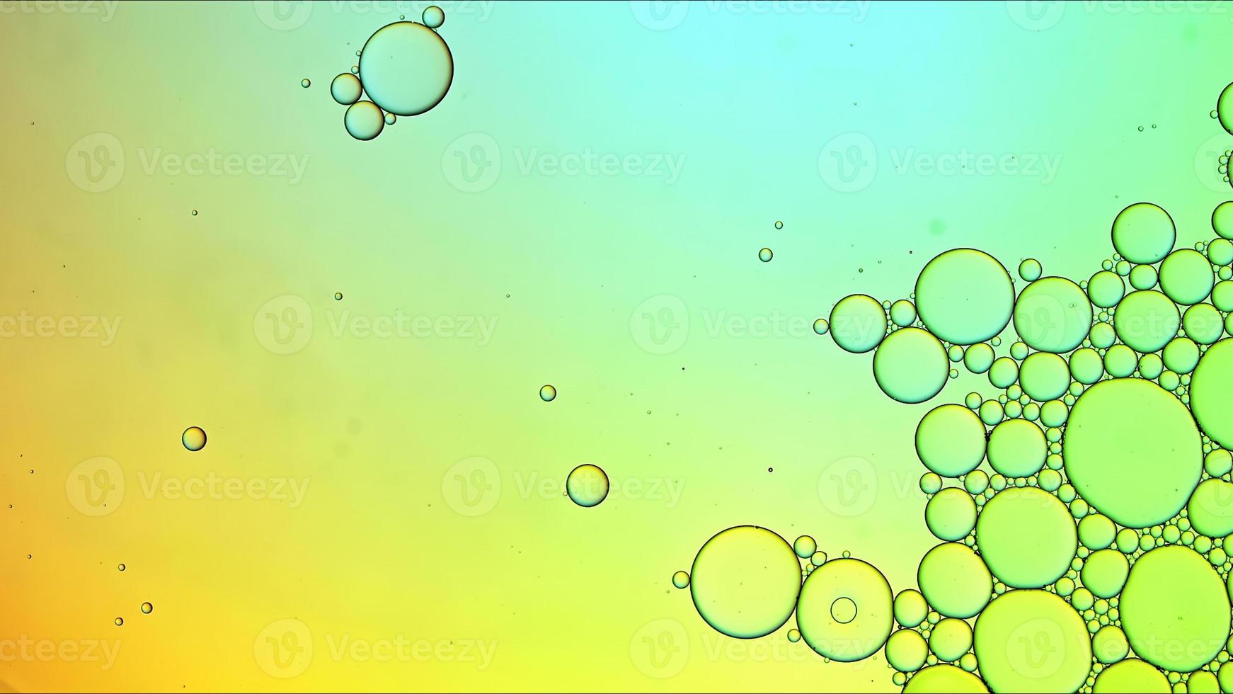 Abstract Colorful Food Oil Drops Bubbles and spheres Flowing on Water Surface photo