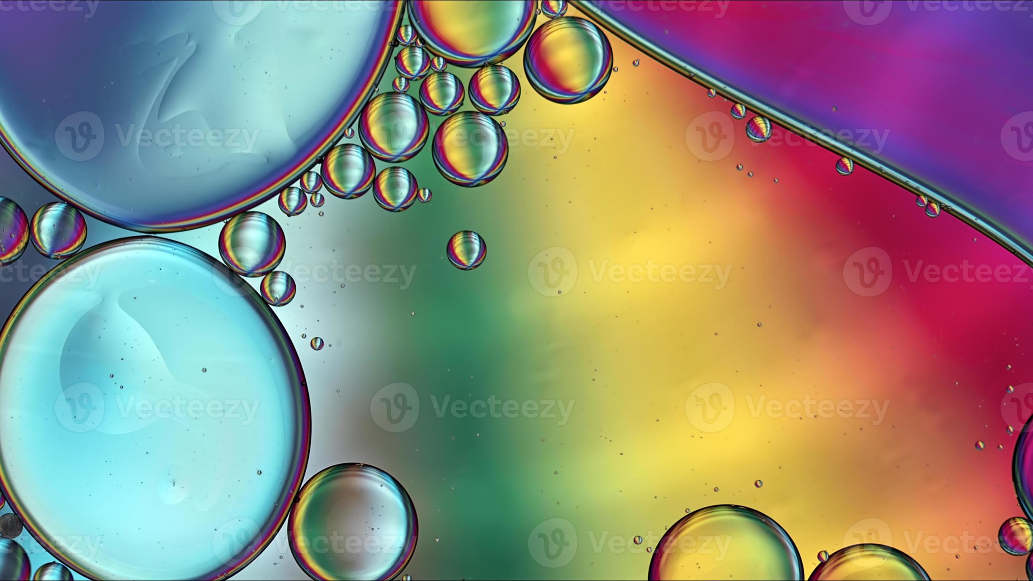 Abstract Colorful Food Oil Drops Bubbles and spheres Flowing on Water