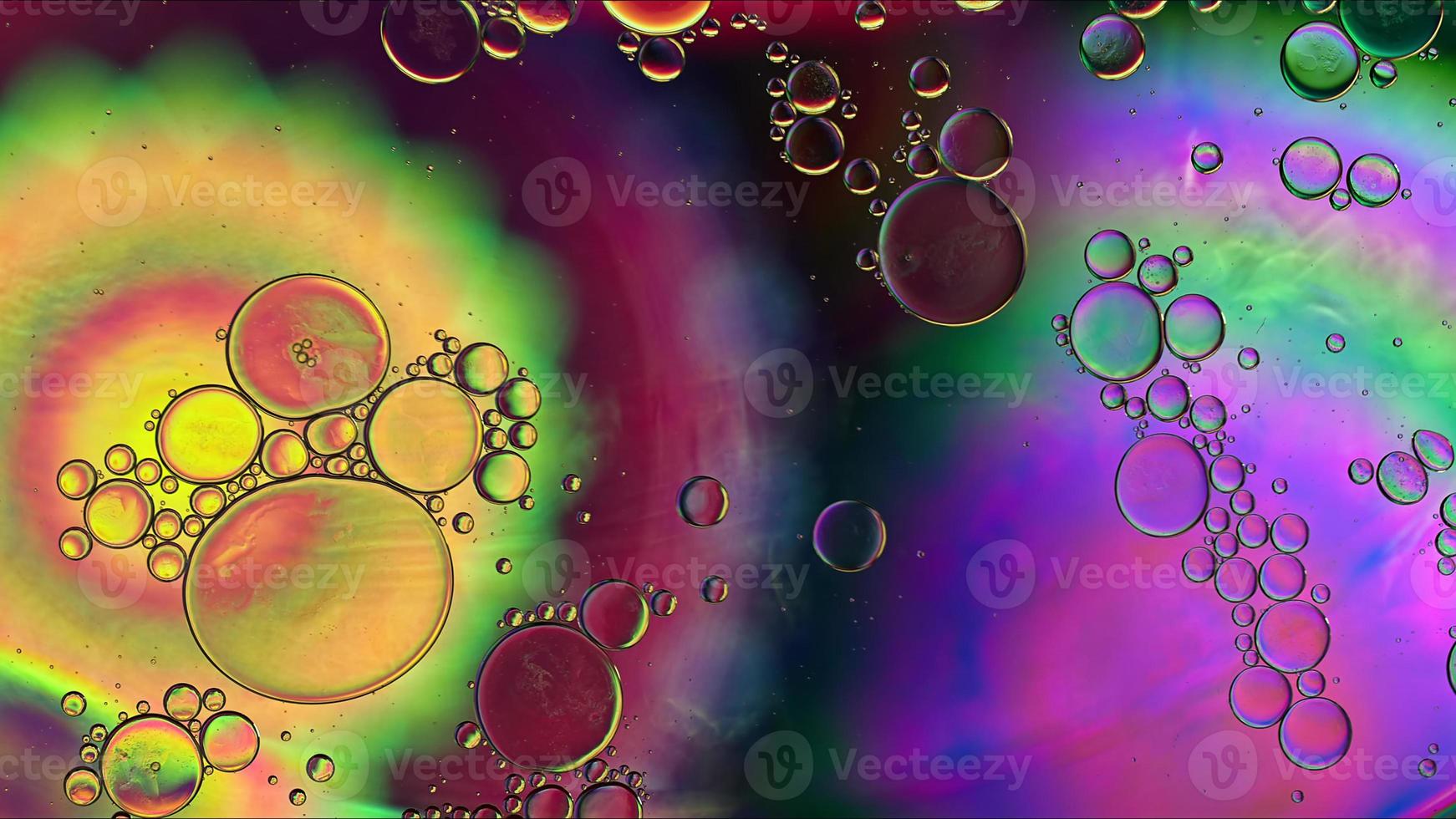 Abstract Colorful Food Oil Drops Bubbles and spheres Flowing on Water Surface photo