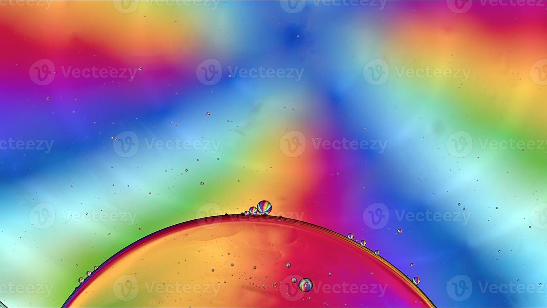 Abstract Colorful Food Oil Drops Bubbles and spheres Flowing on Water Surface photo