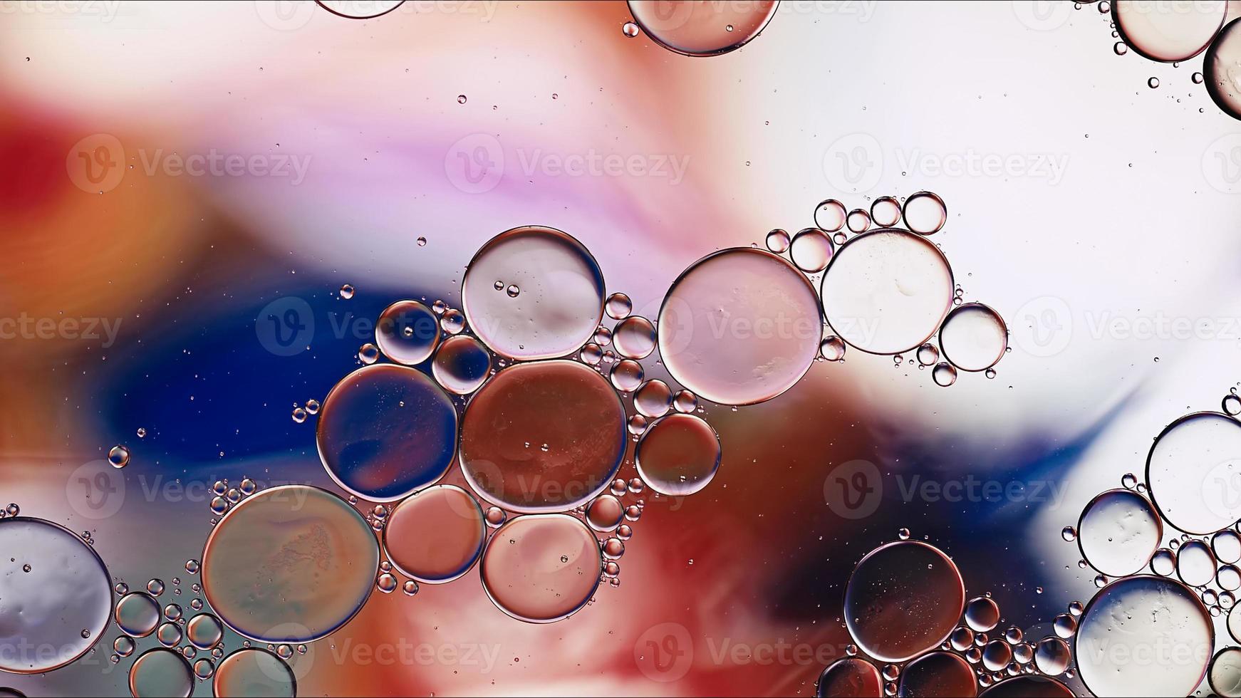 Abstract Colorful Food Oil Drops Bubbles and spheres Flowing on Water Surface photo