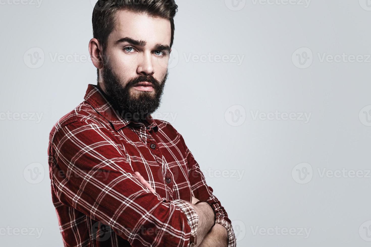 Handsome bearded man wearing checkered shirt photo