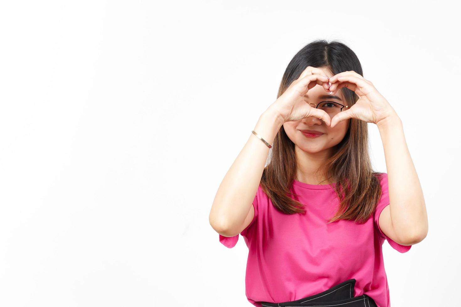 Showing Love Heart Sign of Beautiful Asian Woman Isolated On White Background photo