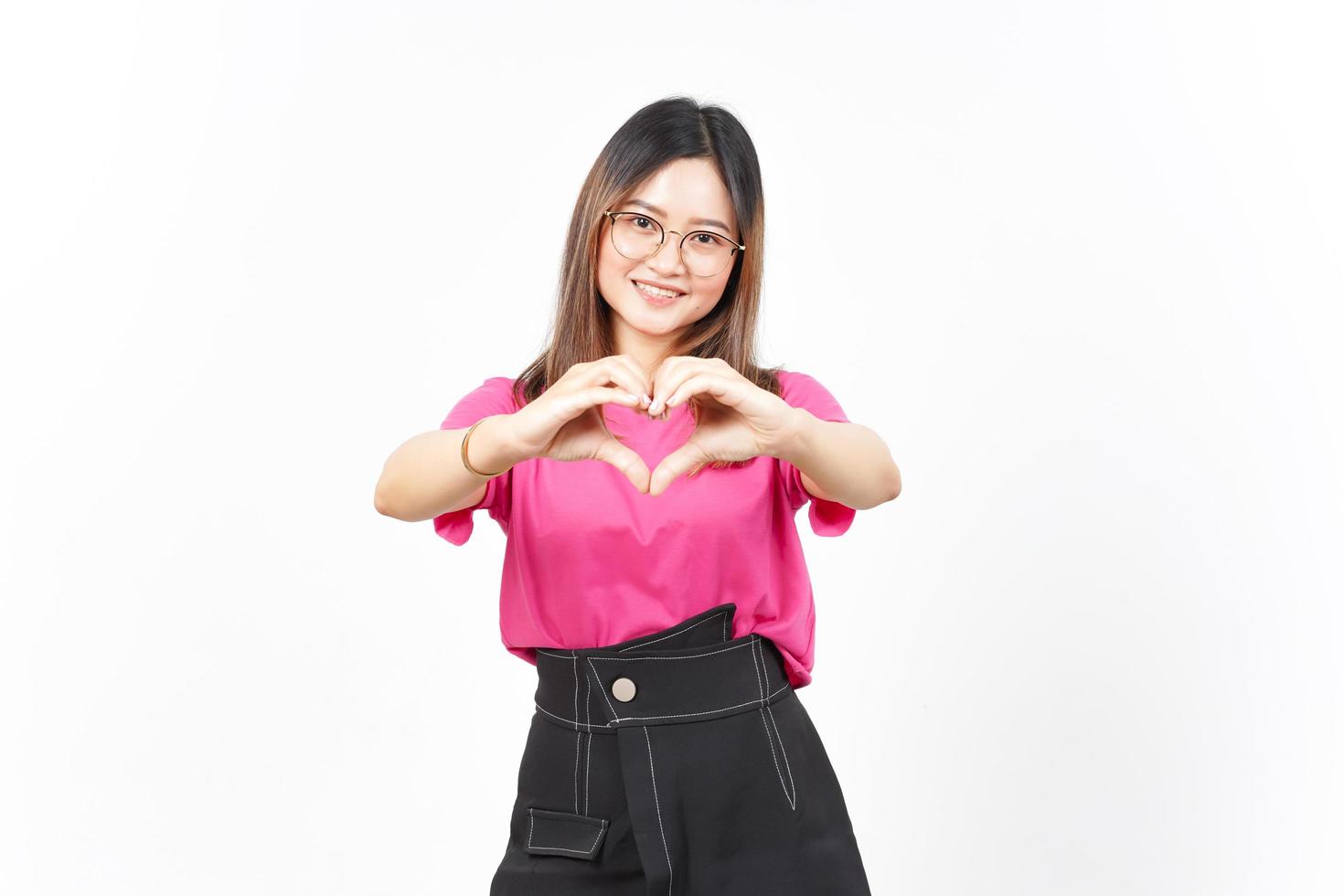 Showing Love Heart Sign of Beautiful Asian Woman Isolated On White Background photo