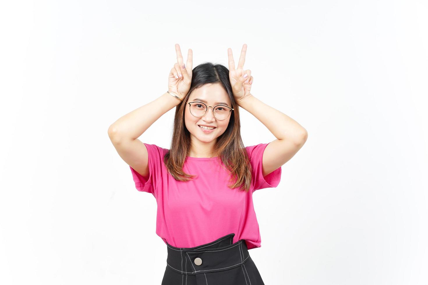 Showing Peace Sign of Beautiful Asian Woman Isolated On White Background photo