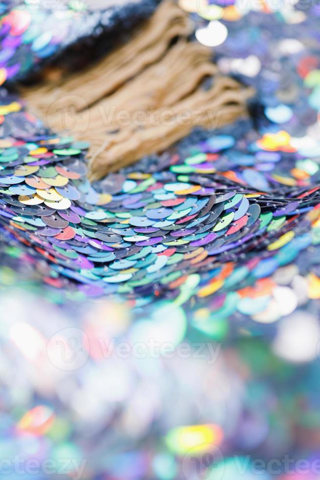 Closeup shot of a shiny multicolored sequin fabric. photo