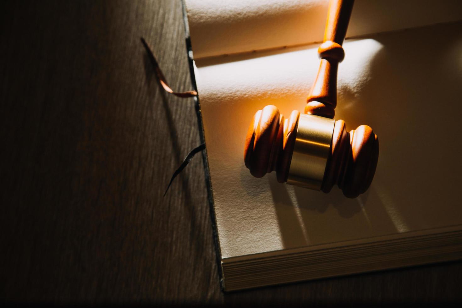 Business and lawyers discussing contract papers with brass scale on desk in office. Law, legal services, advice, justice and law concept picture with film grain effect photo