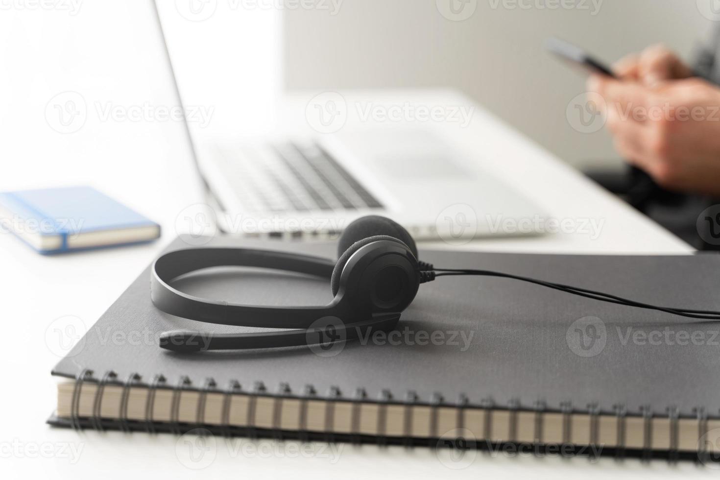 Headset on the table call center worker's workplace photo