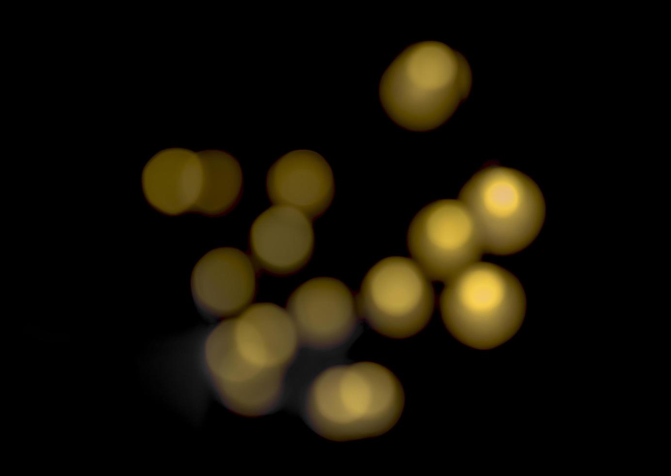 Golden color bokeh on black background photo