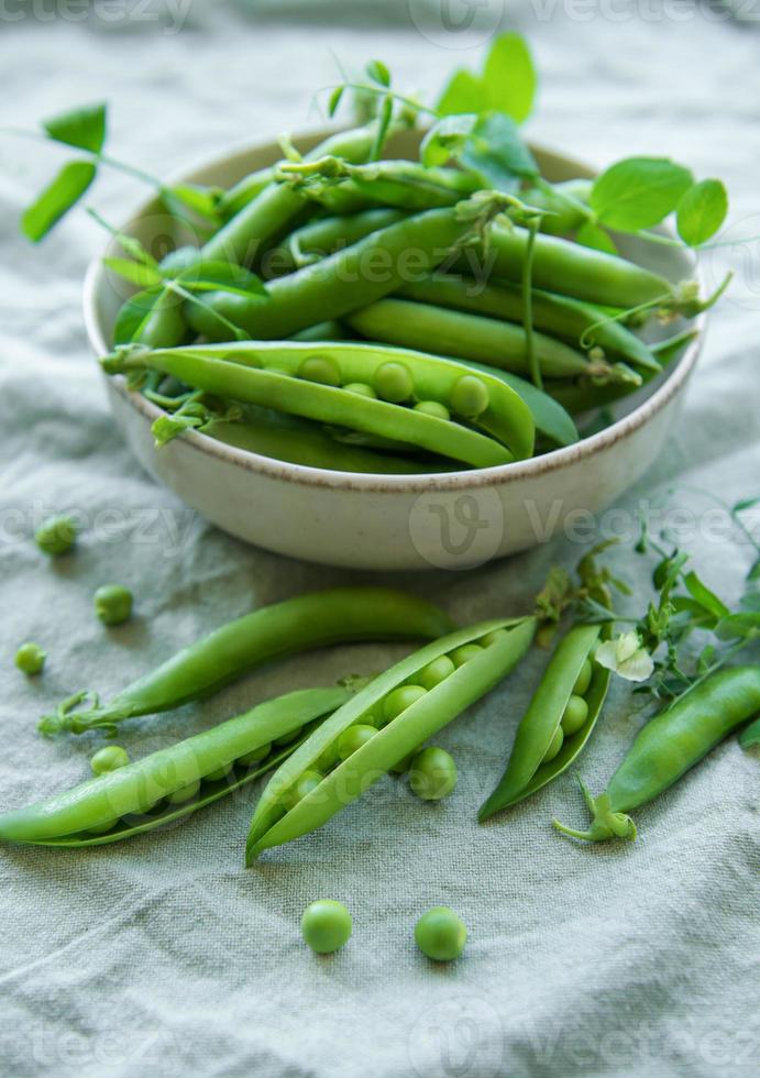 Bowl with sweet pea pods photo