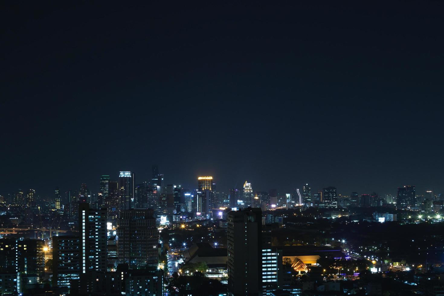 Scenic view of Modern Bangkok city at night photo