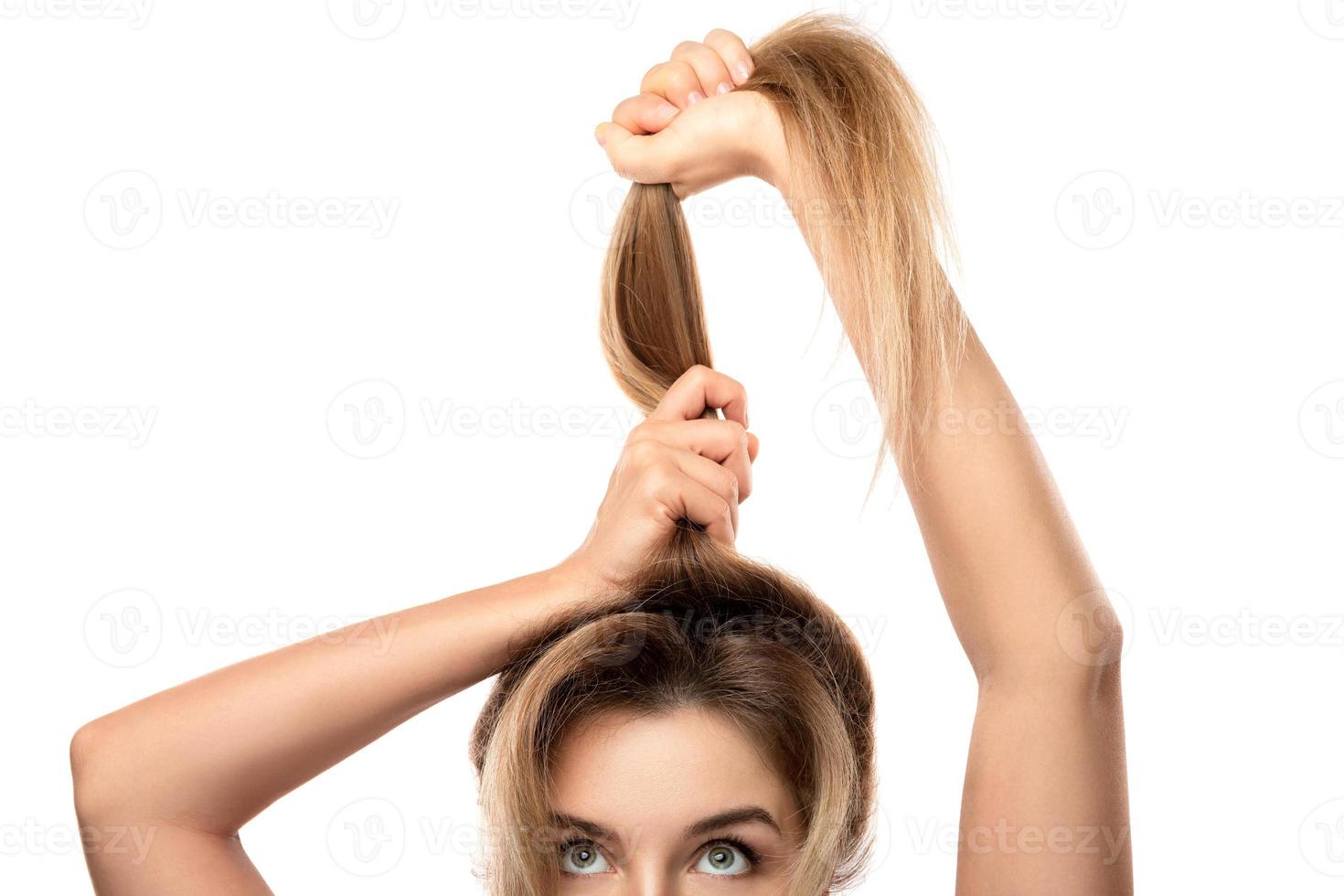 Beautiful woman is very happy of her hair growth progress photo